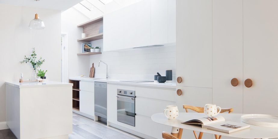 Smarter Bathrooms and Kitchens - a bright and modern kitchen filled with ivory white colour. Beautiful kitchen designs built by kitchen renovation Melbourne specialist