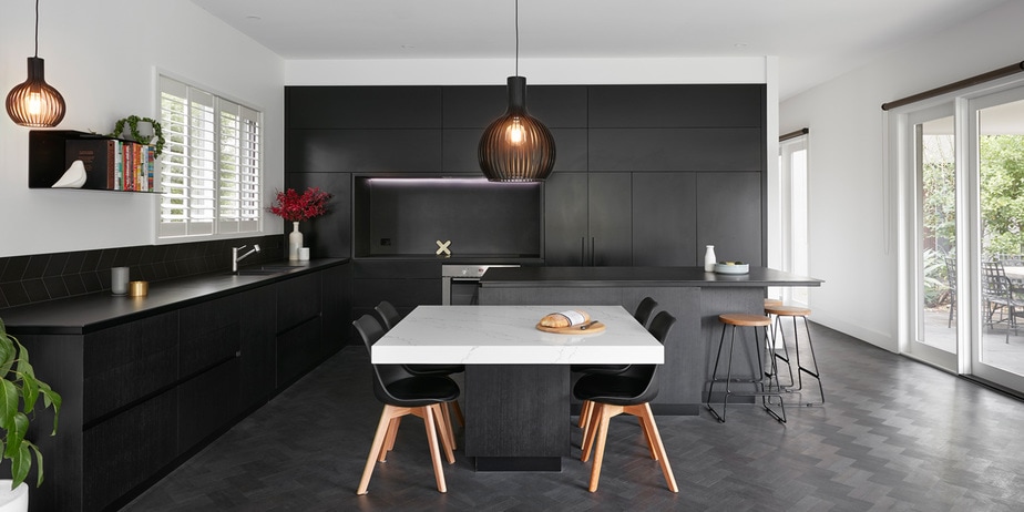 Smarter Bathrooms and Kitchens - a modern kitchen with a combination of black, wood, and white. Beautiful kitchen design built by kitchen renovations Melbourne specialist