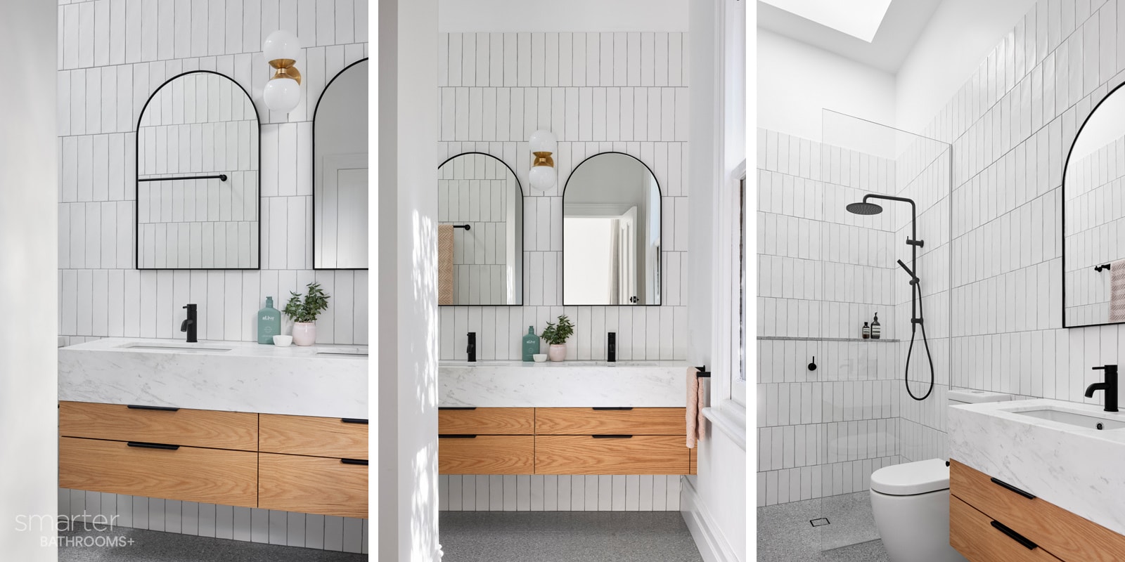 beautiful tiled bathroom with arched mirrors